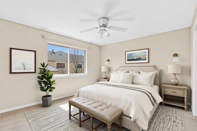 bedroom with baseboards, carpet flooring, and a ceiling fan
