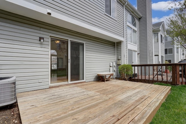 wooden terrace featuring central AC unit