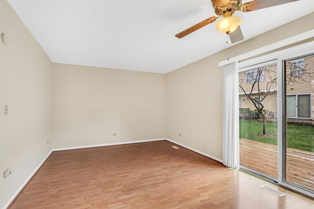 unfurnished room with a ceiling fan, baseboards, visible vents, and light wood-type flooring