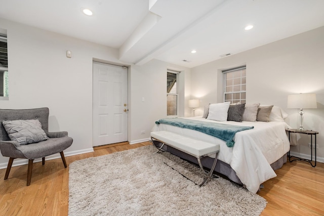 bedroom with recessed lighting, baseboards, visible vents, and light wood-style flooring