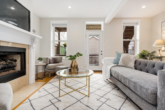 living area featuring recessed lighting, wood finished floors, and a fireplace
