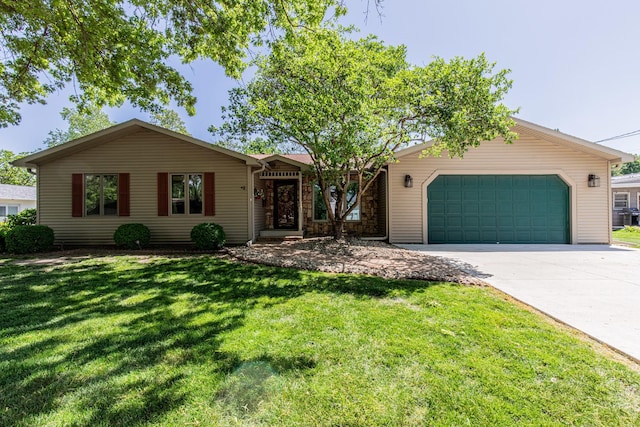 11 N Beech St, Princeton, IL 61356 - ranch-style home featuring a garage, concrete driveway, and a front lawn