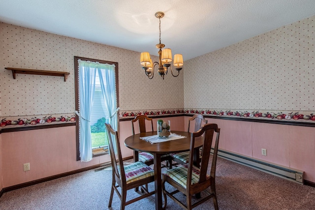 11 N Beech St, Princeton, IL 61356 - dining area featuring a chandelier, baseboard heating, wallpapered walls, carpet, and wainscoting