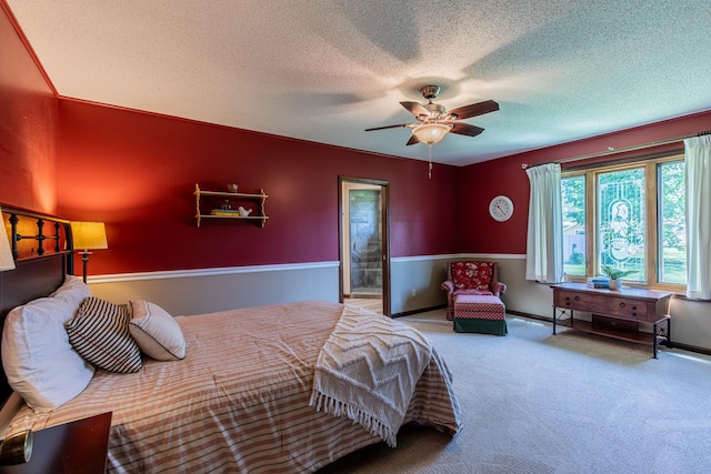 11 N Beech St, Princeton, IL 61356 - carpeted bedroom featuring a textured ceiling, a ceiling fan, and baseboards