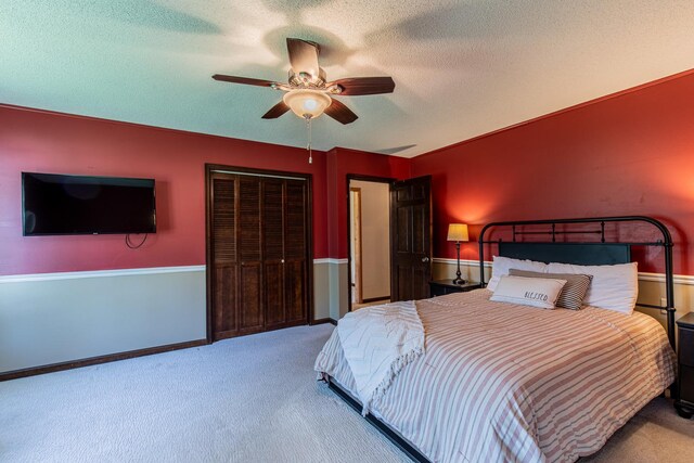 11 N Beech St, Princeton, IL 61356 - carpeted bedroom with a closet, a textured ceiling, and ceiling fan