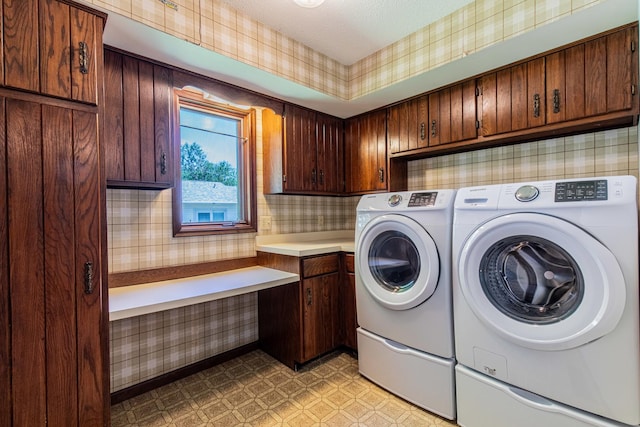 11 N Beech St, Princeton, IL 61356 - clothes washing area with wallpapered walls, washer and dryer, cabinet space, and light flooring