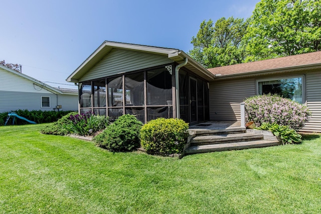 11 N Beech St, Princeton, IL 61356 - back of house featuring a sunroom and a lawn