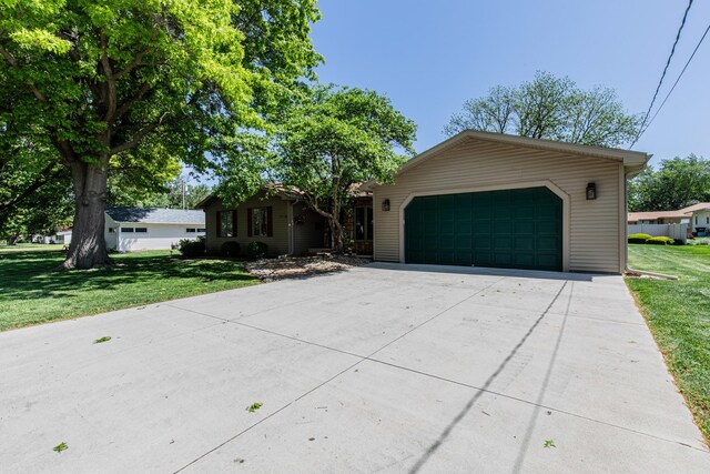 11 N Beech St, Princeton, IL 61356 - ranch-style house featuring a garage, a front lawn, and concrete driveway