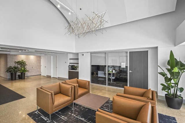 common area featuring a towering ceiling
