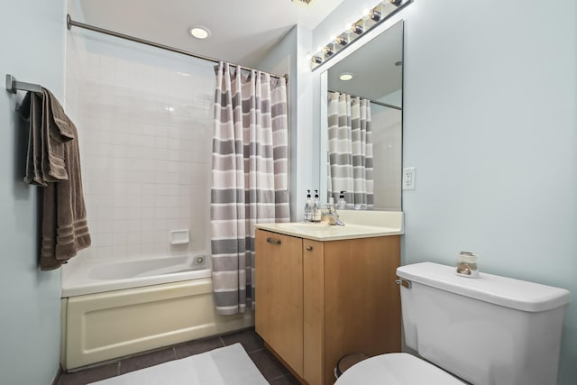 bathroom with tile patterned flooring, shower / bath combo, toilet, and vanity