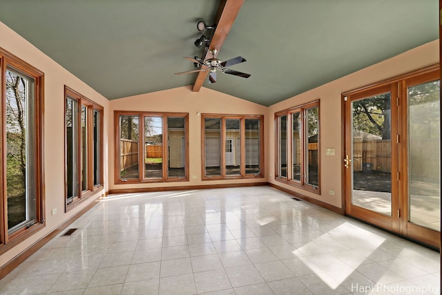 unfurnished sunroom featuring tile patterned flooring, lofted ceiling with beams, baseboards, and visible vents