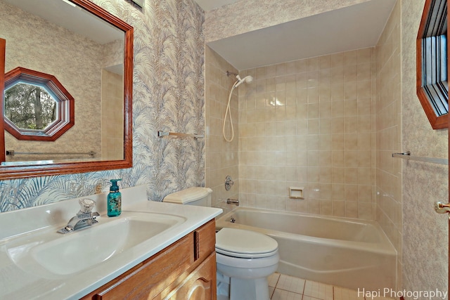 full bath featuring vanity, tile patterned flooring, toilet, wallpapered walls, and shower / washtub combination