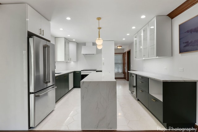 kitchen with high end refrigerator, white cabinets, and recessed lighting
