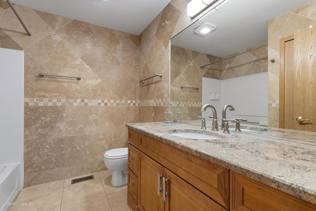 full bath with visible vents, vanity, tile patterned flooring, toilet, and tile walls