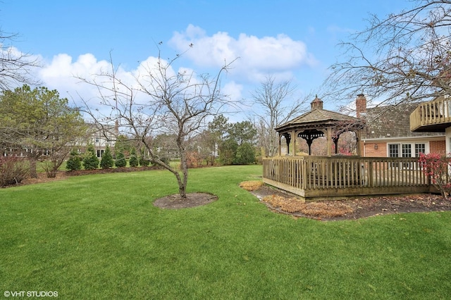 view of yard featuring a gazebo and a deck
