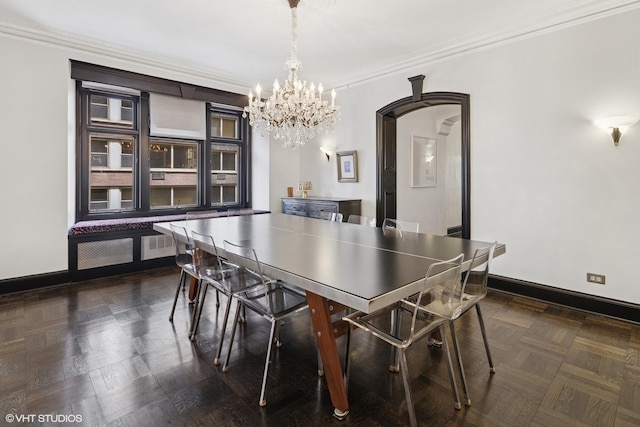 222 E Chestnut St Unit 7B, Chicago, IL 60611 - dining space featuring arched walkways, baseboards, a notable chandelier, and ornamental molding