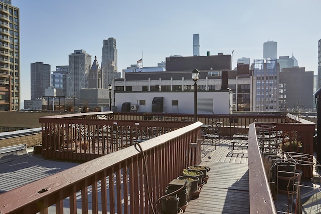 222 E Chestnut St Unit 7B, Chicago, IL 60611 - wooden deck with a view of city
