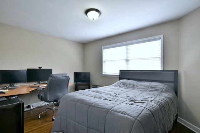 bedroom featuring wood finished floors
