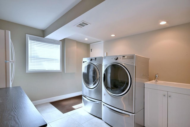 clothes washing area with independent washer and dryer, recessed lighting, baseboards, light tile patterned floors, and visible vents