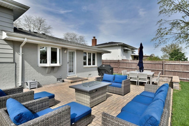 view of patio / terrace with an outdoor hangout area, fence, outdoor dining area, and grilling area