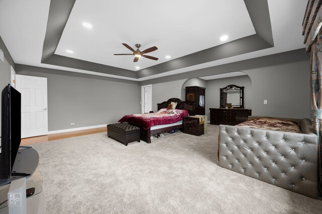 401 Jason Ln, Schaumburg, IL 60173 - carpeted bedroom with a ceiling fan, baseboards, recessed lighting, a raised ceiling, and arched walkways