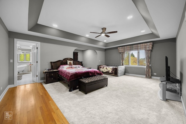 401 Jason Ln, Schaumburg, IL 60173 - bedroom with baseboards, multiple windows, and a tray ceiling