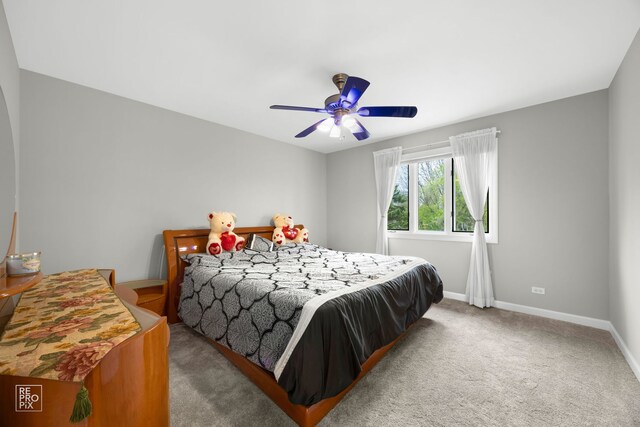 401 Jason Ln, Schaumburg, IL 60173 - carpeted bedroom featuring baseboards and ceiling fan