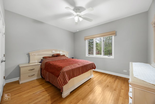 401 Jason Ln, Schaumburg, IL 60173 - bedroom with baseboards, ceiling fan, and light wood-type flooring