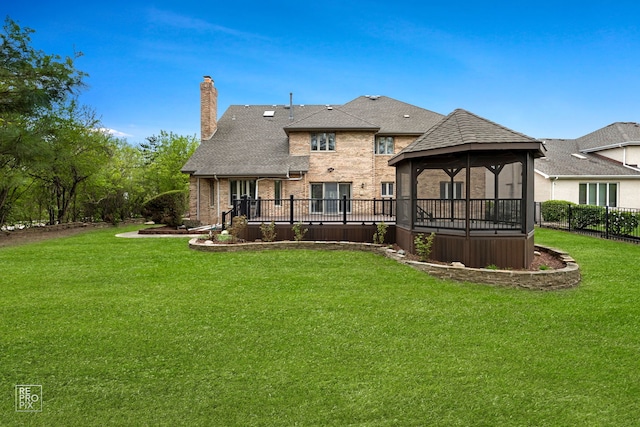 401 Jason Ln, Schaumburg, IL 60173 - back of house with a lawn, roof with shingles, a chimney, brick siding, and a gazebo