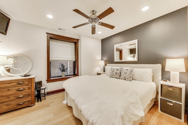 bedroom featuring light wood-type flooring, recessed lighting, and visible vents