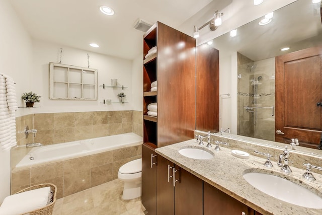 full bath with a sink, a stall shower, recessed lighting, and a garden tub