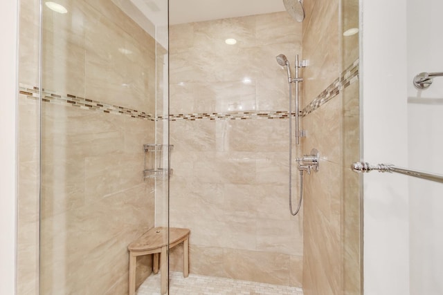 bathroom with a tile shower