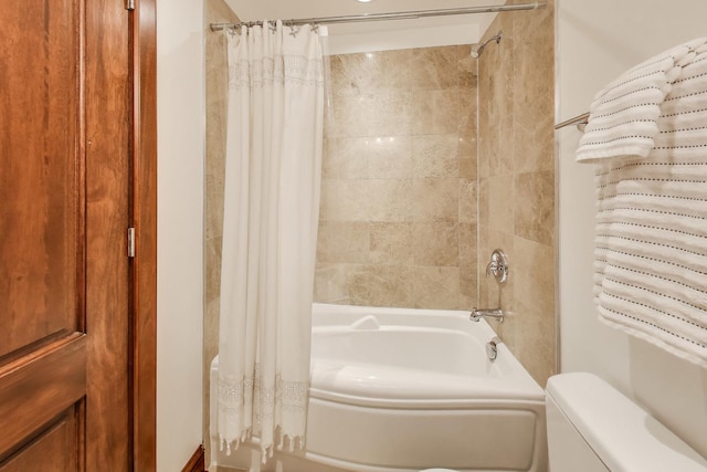 full bathroom featuring toilet and shower / tub combo with curtain
