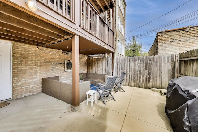 view of patio featuring a fenced backyard, an outdoor hangout area, and area for grilling