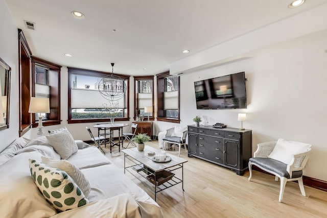 living area featuring recessed lighting, visible vents, a chandelier, and light wood-type flooring