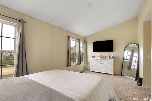 2815 Kendall Xing, Johnsburg, IL 60051 - bedroom featuring baseboards, vaulted ceiling, and light carpet