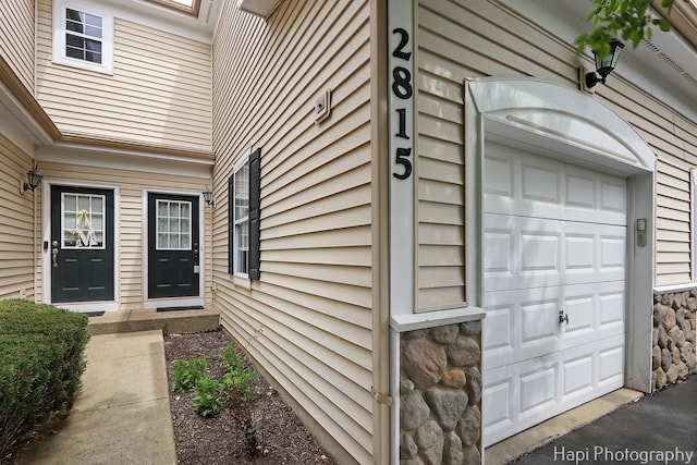 2815 Kendall Xing, Johnsburg, IL 60051 - entrance to property with a garage and stone siding