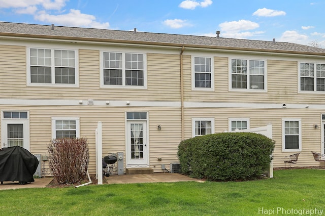 2815 Kendall Xing, Johnsburg, IL 60051 - back of property with a lawn, central AC unit, and a patio