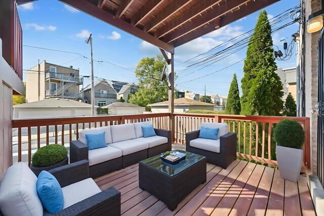 wooden terrace with outdoor lounge area and a residential view