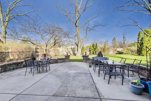 view of patio with outdoor dining area and a fenced backyard