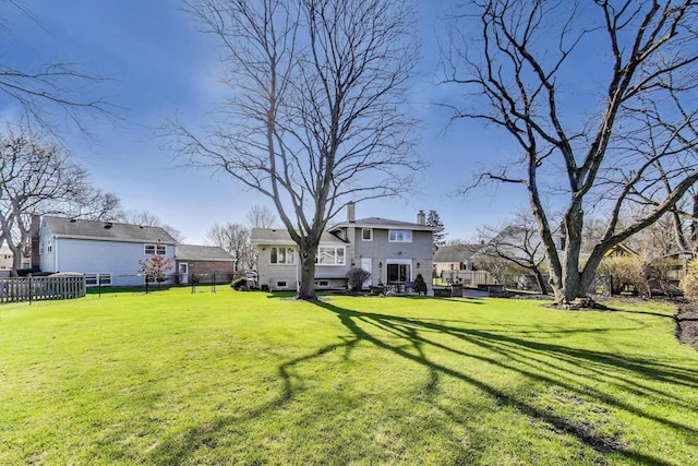 view of yard featuring fence and a residential view