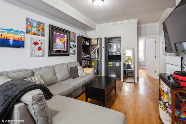 534 W Belmont Ave Unit 2S, Chicago, IL 60657 - living room with stacked washing maching and dryer, baseboards, ornamental molding, and wood finished floors