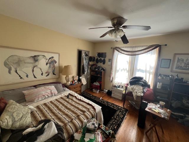 bedroom featuring a ceiling fan and hardwood / wood-style floors