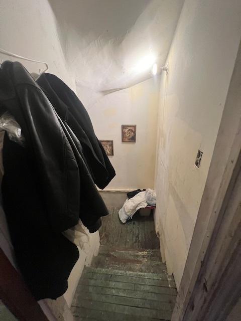stairway with lofted ceiling