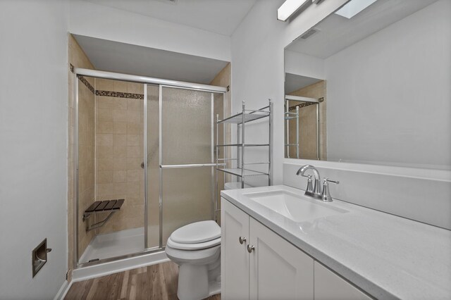 848 Stewart St, Batavia, IL 60510 - bathroom featuring toilet, a shower stall, vanity, and wood finished floors