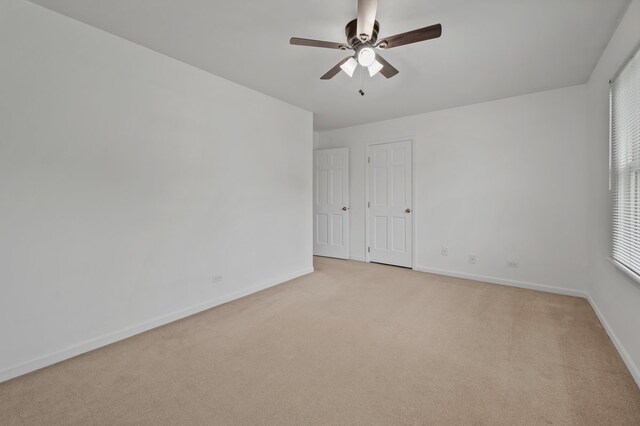 848 Stewart St, Batavia, IL 60510 - empty room featuring ceiling fan, baseboards, and light colored carpet