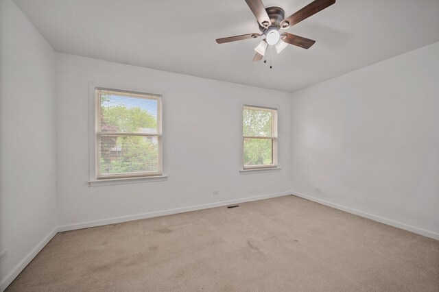 848 Stewart St, Batavia, IL 60510 - carpeted spare room with baseboards and a ceiling fan
