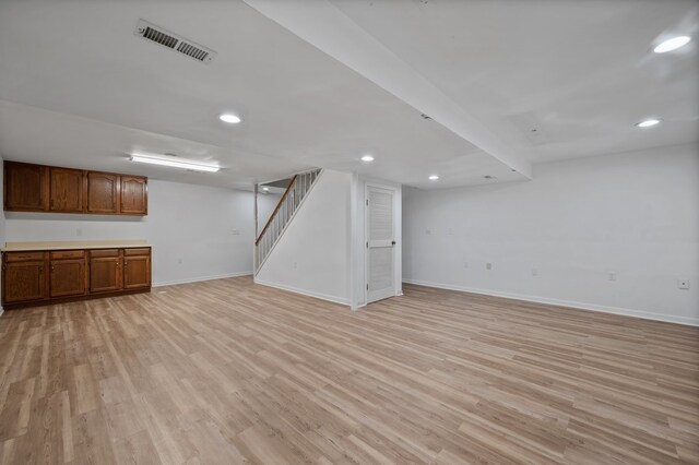 848 Stewart St, Batavia, IL 60510 - finished below grade area with baseboards, light wood finished floors, stairway, and recessed lighting