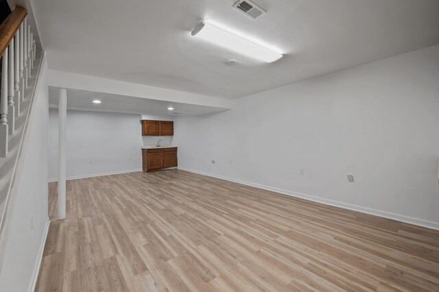 848 Stewart St, Batavia, IL 60510 - finished below grade area with light wood finished floors, recessed lighting, baseboards, and bar area