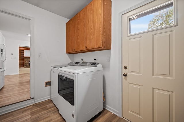 848 Stewart St, Batavia, IL 60510 - washroom featuring cabinet space, independent washer and dryer, wood finished floors, and baseboards